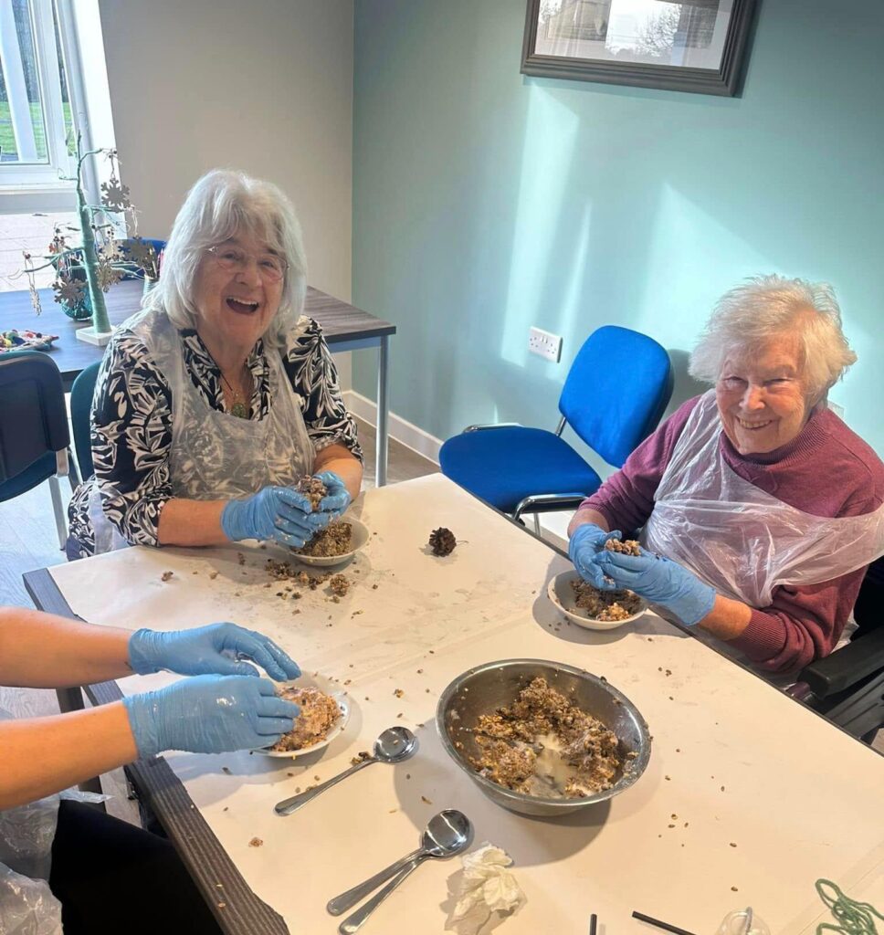 residents making birdfeeder