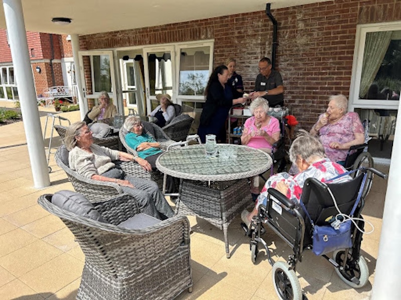 residents sat with a cone and ice cream in the garden