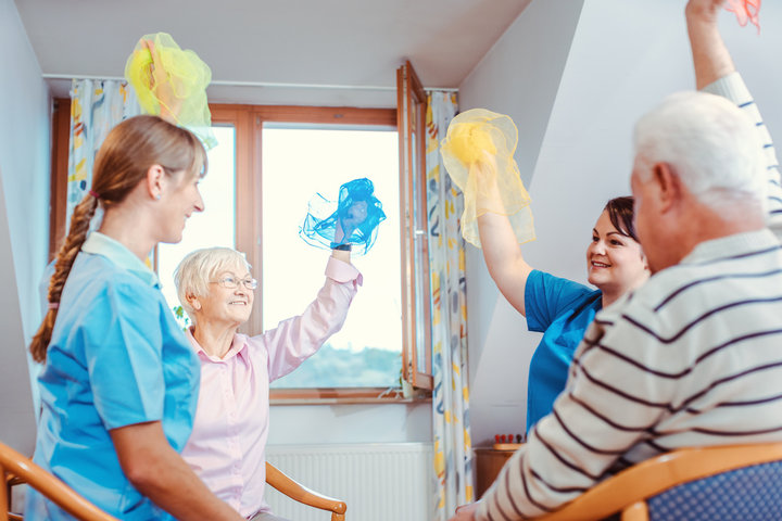 seniors doing a gym glass in chairs