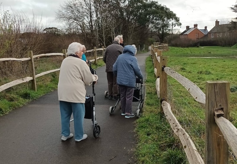 group of residents outside on a walk together