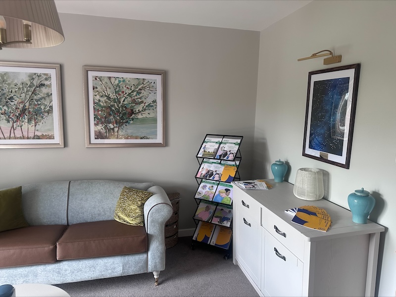 sofa, informational leaflets and our constellation map in our reflection room