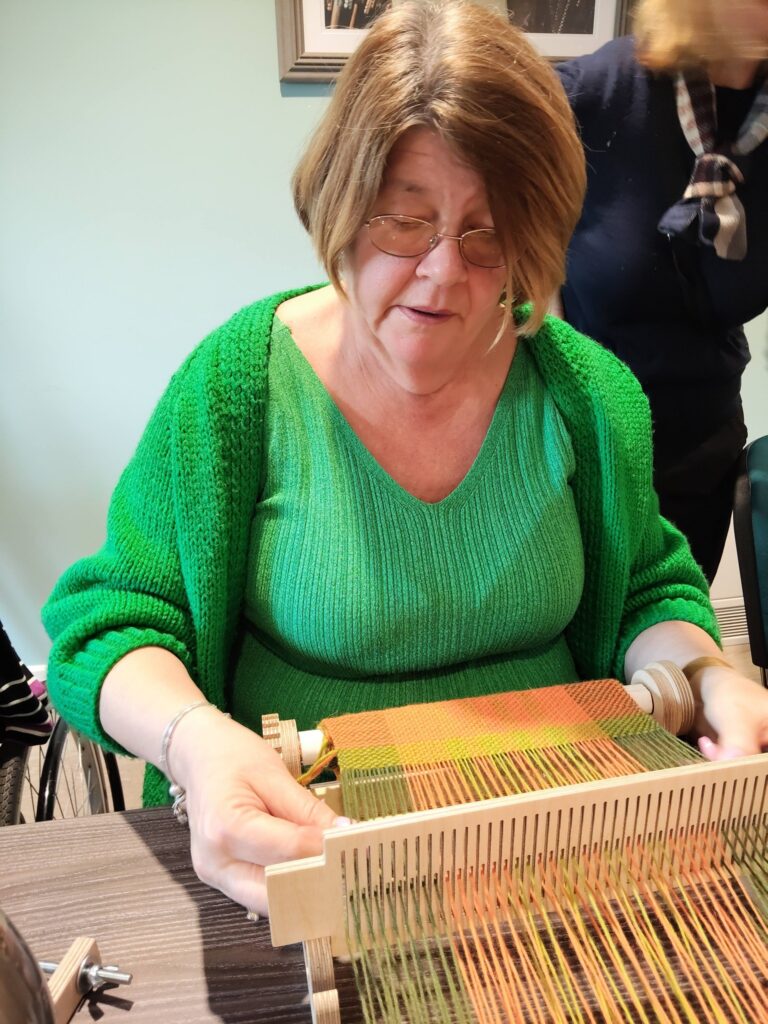 older lady weaving