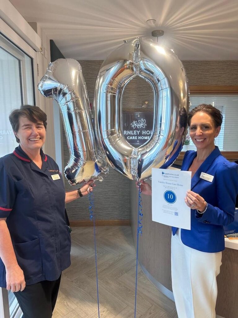 our manager and deputy stood with number 10 balloons