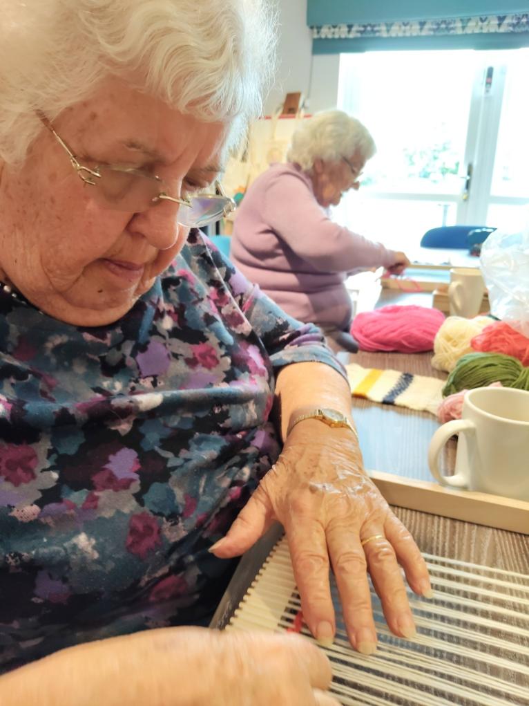 older lady weaving