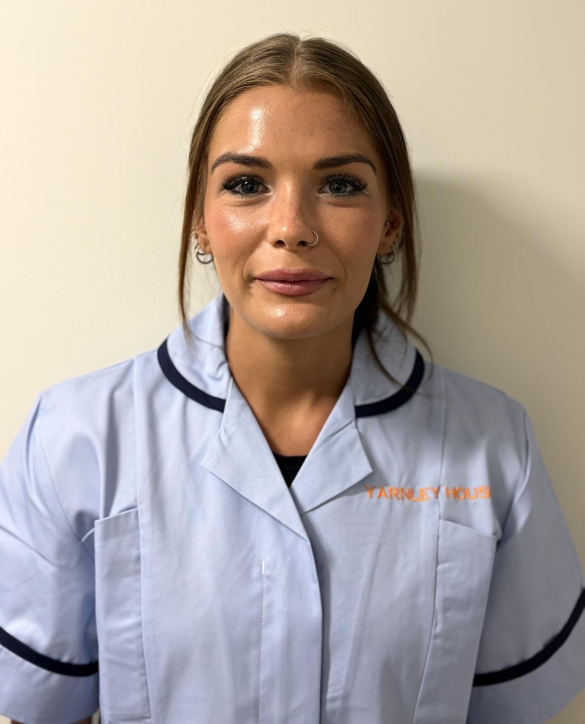 lady posing for staff photo