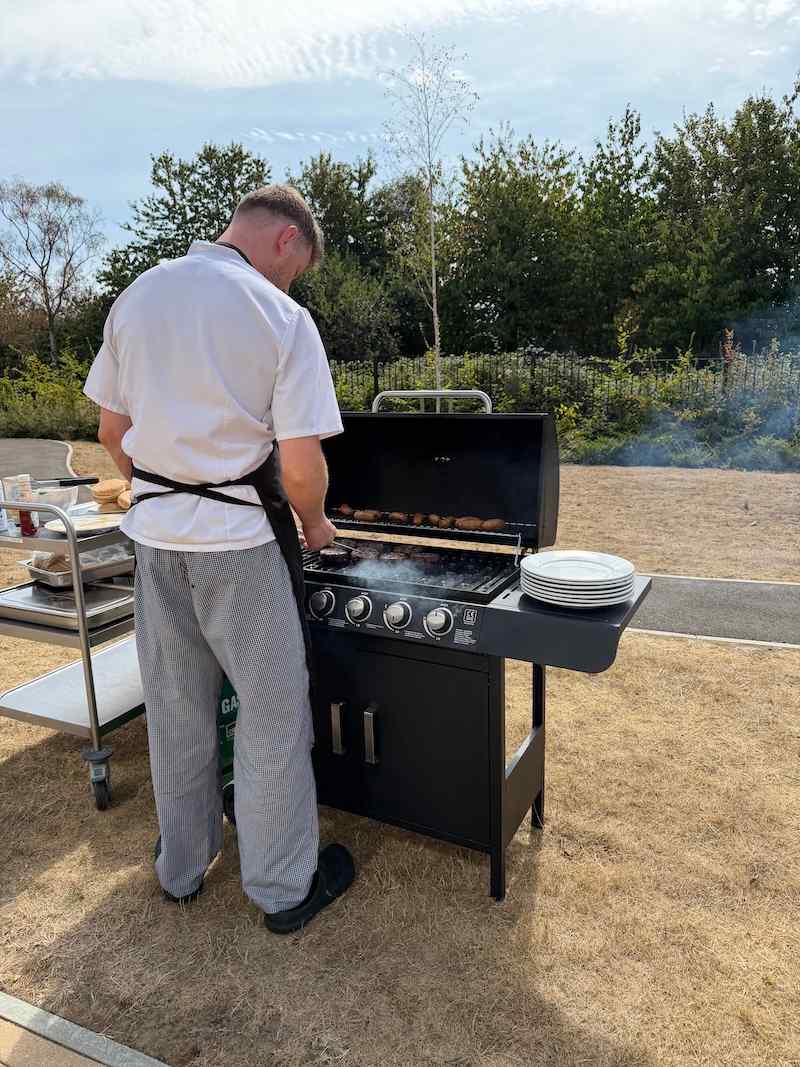 our chef cooking a bbq in the garden