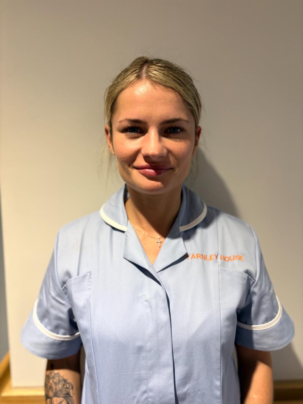 woman posing for staff photo