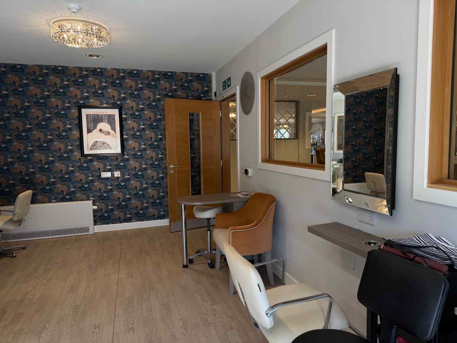 seating area in our hair salon with magazines